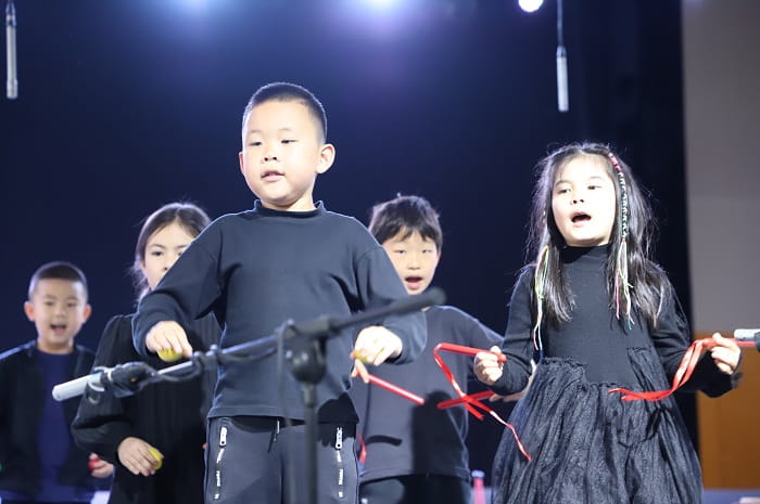 Kindergarten students sing an African song