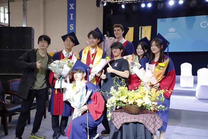 Graduates with flowers
