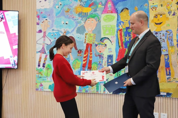 Elementary student receives a certificate