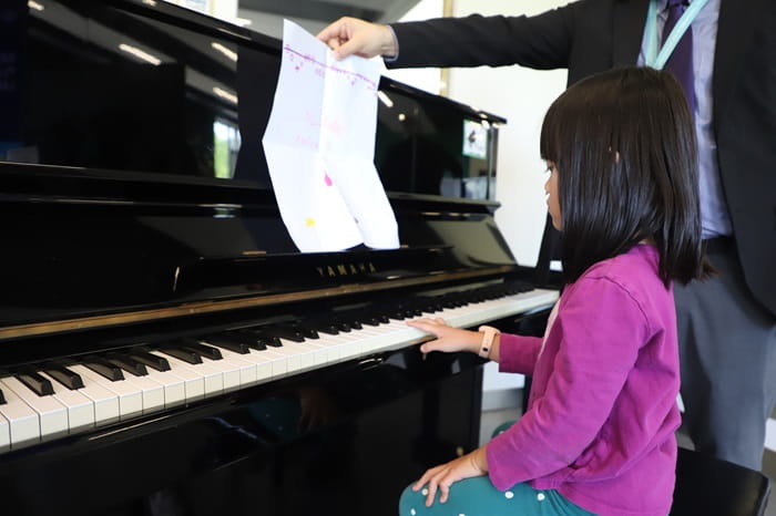 Little girl playing the piano