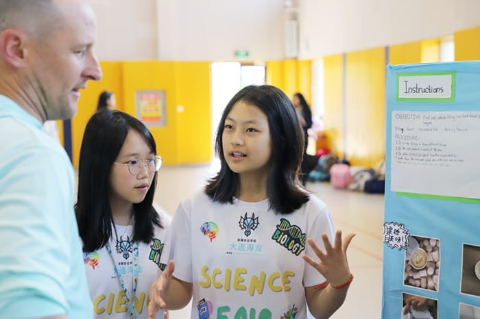 A girl explains her science project