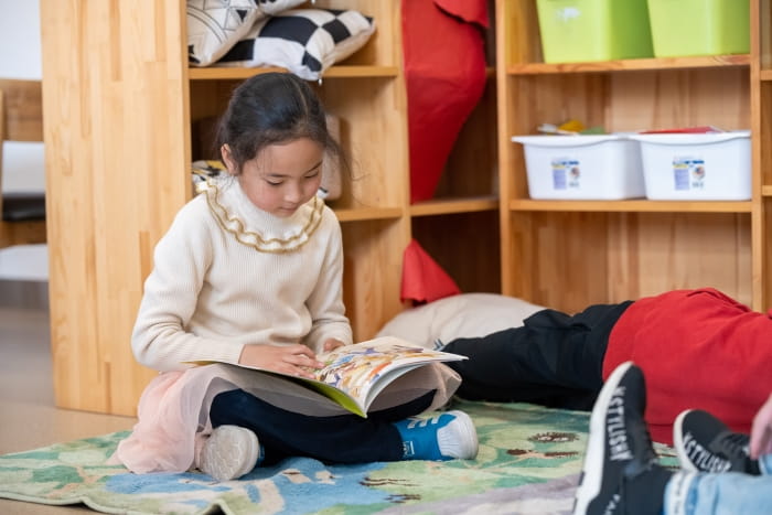 elementary student reading a book