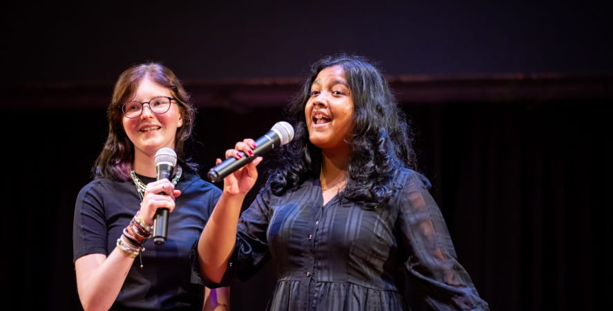 Two girls singing