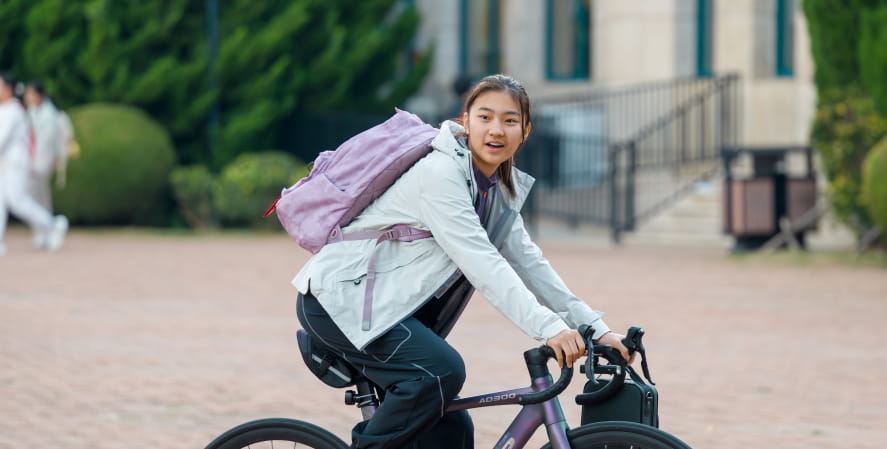 Student riding a bike